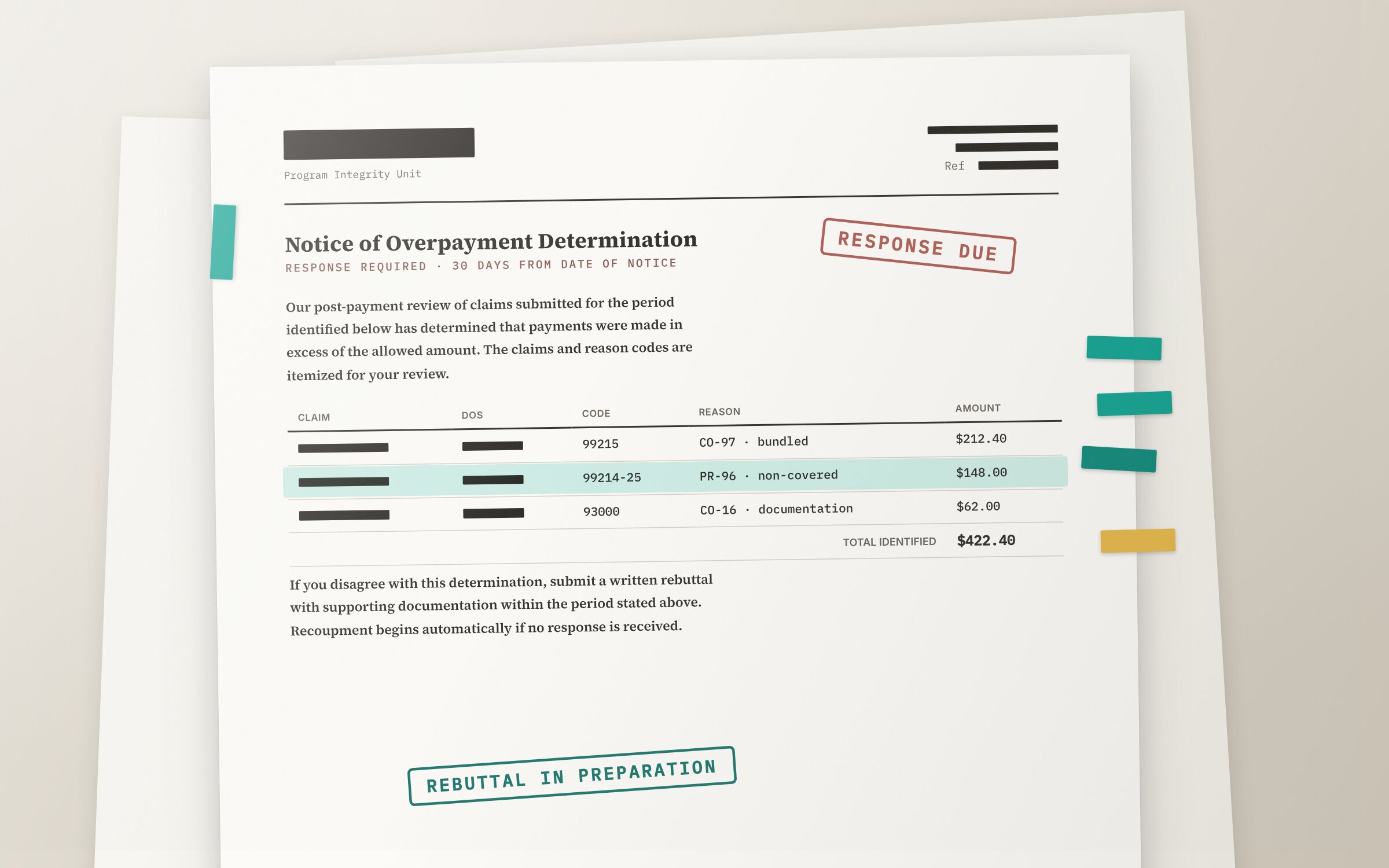 A payer overpayment notice on a desk, claims flagged for rebuttal, details redacted